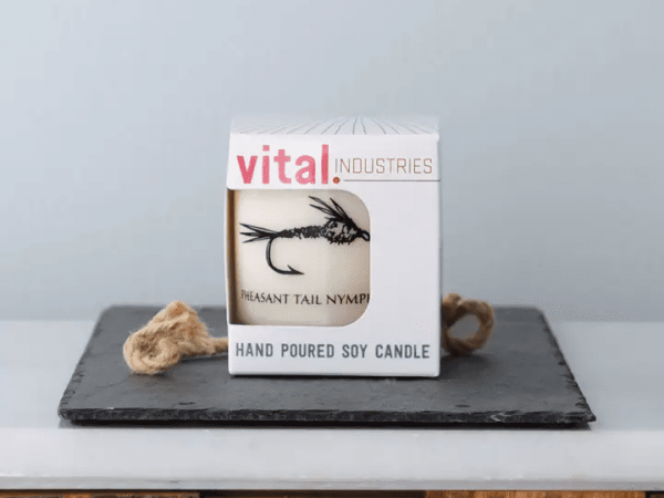 Soy Candle in a rocks glass with a Wooly Bugger fly design.