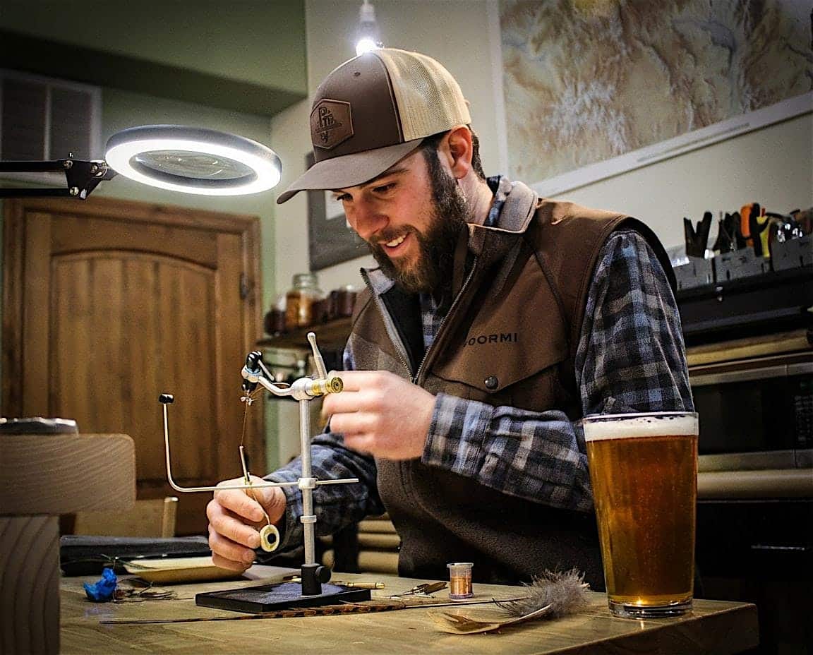Man over a vice on a desk