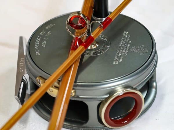 pieces of a rod on top of a reel